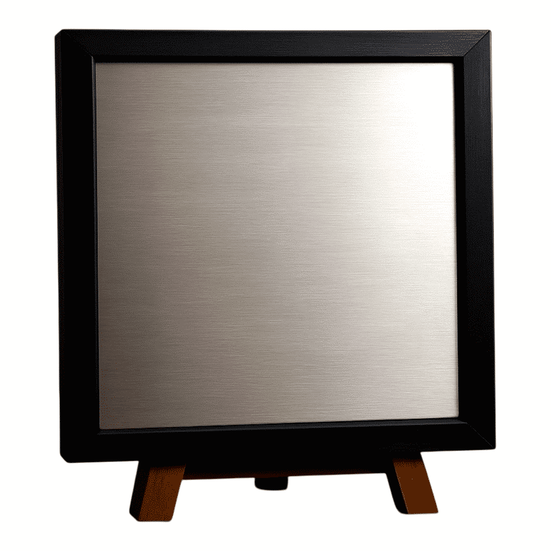 Brushed metal plaque with black frame and wooden stand.